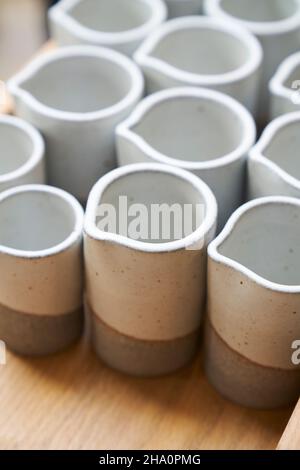 group of ceramic hand made dishes with spouts Stock Photo