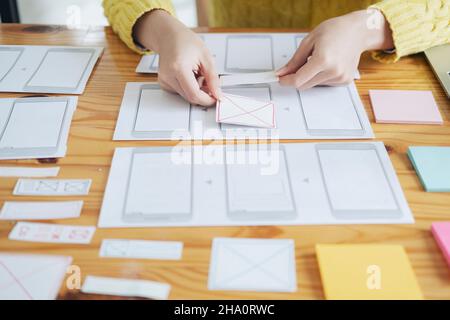 Programmer and UX UI designer working in a software development and coding technologies. Mobile and website design and programing development technolo Stock Photo