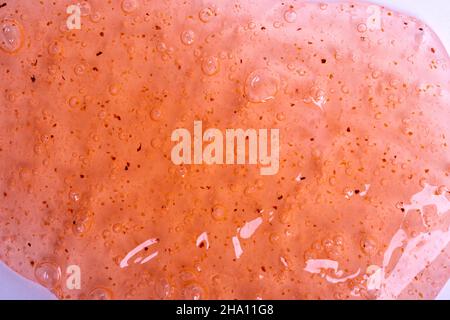 close-up of an orange gel on a white background. Stock Photo