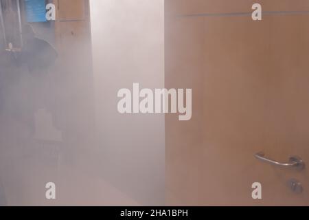 Smog and smoke in the office building - emergency exit Stock Photo