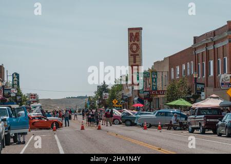 Shelby, MT, US July 10, 2021:  Classic and vintage car show on Main Street in small town America attracts crowds of local residents and tourists to vi Stock Photo