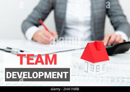 Conceptual caption Team Development. Business concept learn why and how small groups change over time with graphs A Young Lady Orbusiness-Woman Stock Photo