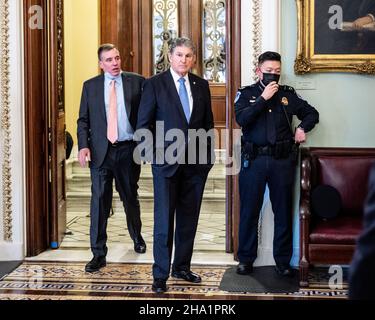 Washington, United States. 09th Dec, 2021. U.S. Senator Joe Manchin (D-WV) stands near the door to the Senate Chamber. Credit: SOPA Images Limited/Alamy Live News Stock Photo