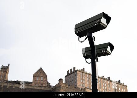 Security surveillance camera system attached on the traffic light pole Stock Photo