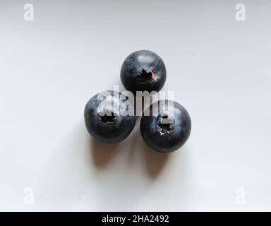 Photography of three blueberries isolated on white for food illustrations Stock Photo