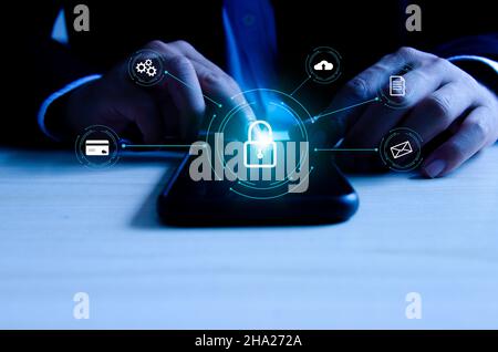 Man hand touching digital mobile phone virtual icon. Cyber ​​security system for smartphones, password access and Internet hacking. Banking informatio Stock Photo