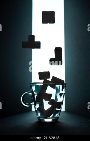 Tea Tetris, sugar cube Tetris figures on a dark background