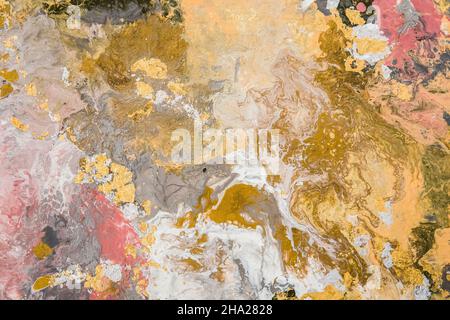 Beautiful fluid abstract paint background. Texture with gold marble pattern. Stock Photo