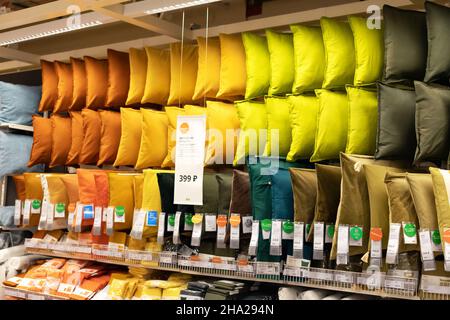 14 June 2021, Ufa, Russia: Assortment of various colored decorative pillows on Ikea store shelves Stock Photo