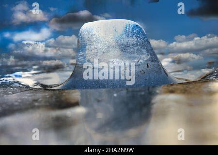 Ice pieces on a lake at sunset in winter atmosphere. cold season Stock Photo
