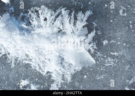 Ice surface with large fluffy snowflakes, natural organic background, top view Stock Photo