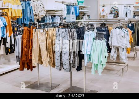 18 August 2021, Ufa, Russia: Child clothing department in H and M store Stock Photo