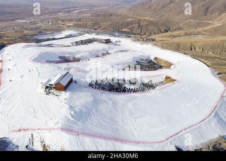 HOHHOT, CHINA - DECEMBER 10,2021 - Aerial photo taken on Dec. 10, 2021 shows the scenery of Mazong mountain Ski resort in Hohhot, Inner Mongolia, Chin Stock Photo