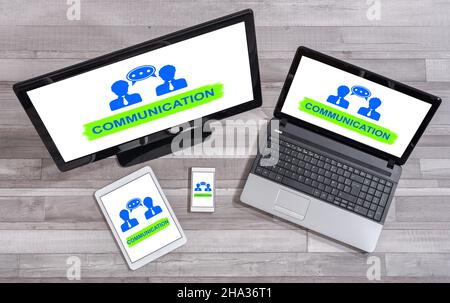 Communication concept shown on different information technology devices Stock Photo