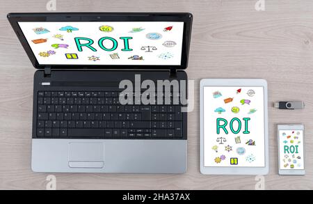Roi concept shown on different information technology devices Stock Photo
