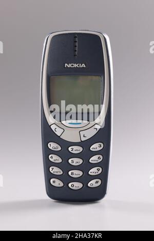 Minsk, Belarus, December 08, 2021: Cell phone Nokia 3310 blue on gray background Stock Photo