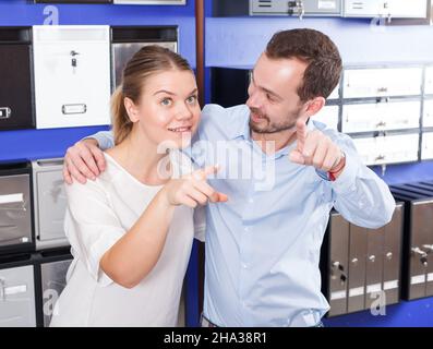 Girl with boyfriend looking for mailbox Stock Photo
