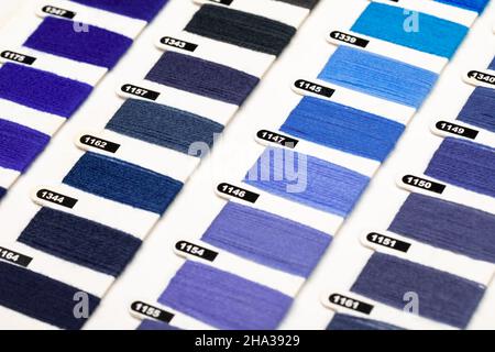 Various blue and violet trendy color of the year 2022 hue yarn thread sample swatches close-up Stock Photo