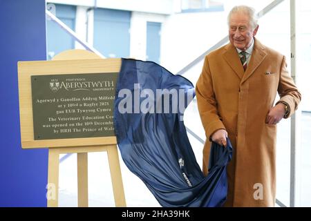 The Prince of Wales unveils a commemorative plaque to open Aberystwyth University's new School of Veterinary Science at Aberystwyth University, Penglais, Aberystwyth in Ceredigion, Wales. Picture date: Friday December 10, 2021. Stock Photo