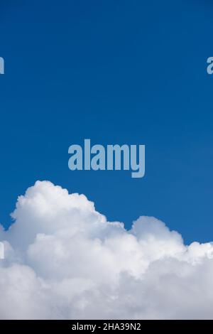 Fluffy white cloud on deep blue sky Stock Photo