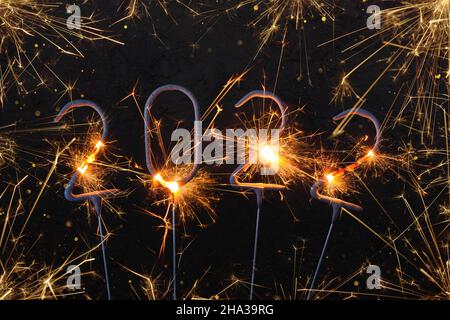 2022 Happy new year card with with shiny sparklers Stock Photo