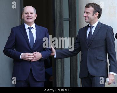 Paris, France. 10th Dec, 2021. French President Emmanuel Macron (R) greets German Chancellor Olaf Scholz as he arrives at the Elysee Palace in Paris on Friday, December 10, 2021. The visit to Paris comes just few days after Scholz officially took over the role from his predecessor Angela Merkel. The two leaders are expected to discuss the Franco-German relations as well as France's upcoming EU presidency. Photo by David Silpa/UPI Credit: UPI/Alamy Live News Stock Photo