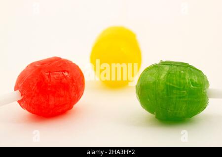 Three delicious lollipops isolated on white. Stock Photo