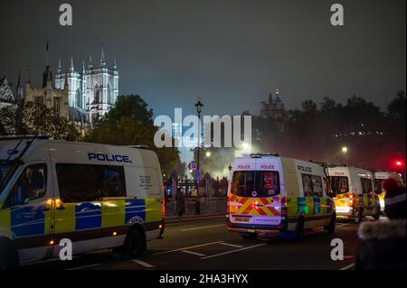 LONDON - NOVEMBER 5, 2021: Police vans parked in Parliament Square during The Million Mask March Stock Photo