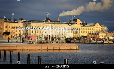 100 flags of Finland on Helsinki Market Square in front of Presidential Palace. Celebrating Finland 100 years. Helsinki, Finland. December 6, 2017. Stock Photo