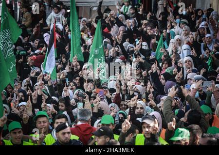 Gaza City, Palestinian Territories. 10th Dec, 2021. Supporters gesture and chant slogans as they take part in a rally marking the 34th anniversary of the founding of the Islamist movement Hamas. Credit: Mohammed Talatene/dpa/Alamy Live News Stock Photo