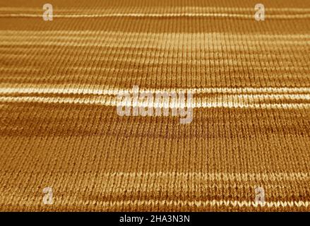 Closeup of Gradient Olive Oil Brown Striped Knitted Wool Fabric in Horizontal Patterns Stock Photo