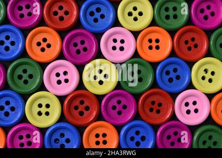 Multi colored buttons on black background. Stock Photo
