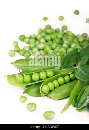 Pods of green peas with pea leaves and flowers isolated on a white background. Organic food Stock Photo