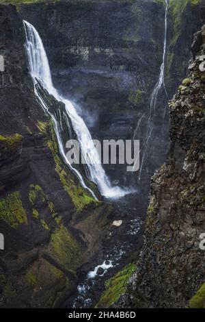 haifoss waterfall in south iceland in the dusk. beautiful nature dramatic moody landscape. vertical view. Stock Photo