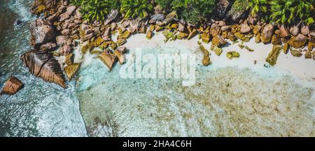 aerial drone bird eye shot of beautiful paradise tropical anse cocos beach at la digue,seychelles. Stock Photo