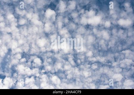 Beautiful blue sky with lots of small clouds Stock Photo