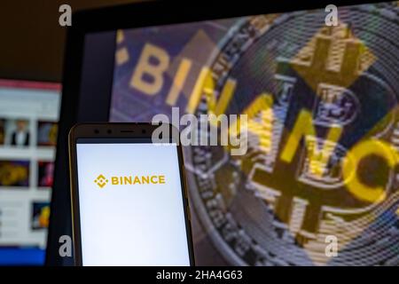 In this photo illustration the Binance logo is seen on the screen of a smartphone. Stock Photo
