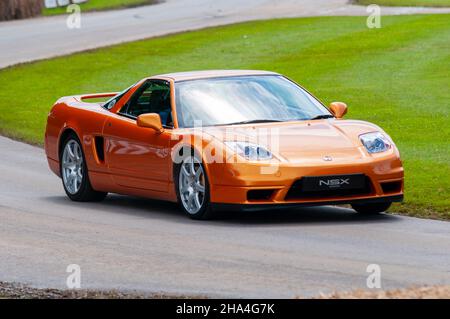 2005 Honda NSX driving up the hill climb track at the Goodwood Festival of Speed motoring event in 2016. First generation sports car Stock Photo