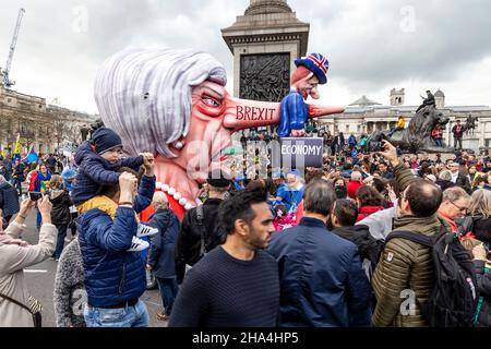 London, UK. 23rd Mar 2019 Over a million people march for the People’s Vote, for a second referendum on Brexit, Theresa May puppet with long nose Stock Photo