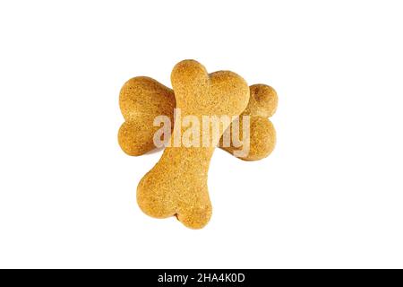 Top view of crunchy brown bone shaped dog biscuit as a treat isolated on white background close up. Stock Photo