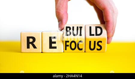 Refocus and rebuild symbol. Businessman turns cubes and changes the ...