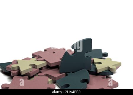 Colorful wooden puzzle pieces against white background Stock Photo