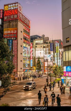 Street scene on Chuo Dori in Akihabara Electric Town district at night, Tokyo, Japan Stock Photo