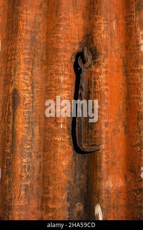 Old Rusty Hook on a Wall Stock Photo