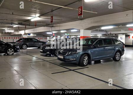germany,north rhine-westphalia,cologne,multi-storey car park,parking spaces,parked cars,inside Stock Photo