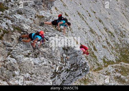 young women on mountain tour over the mittenwalder höhenweg to brunnsteinspitze,germany,bavaria,upper bavaria,mittenwald, Stock Photo