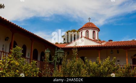 greece,greek islands,ionian islands,lefakada or lefkas,faneromeni monastery,view from the inner courtyard up to the residential buildings and the church dome Stock Photo