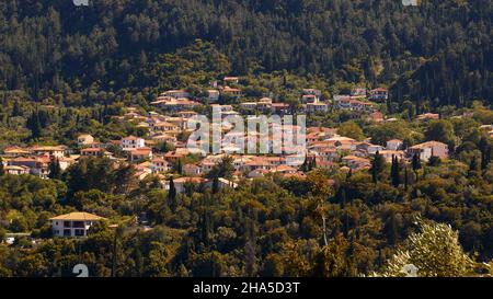 greece,greek islands,ionian islands,lefakada or lefkas,island interior,mountain landscape,mountain village,karya,town view in the afternoon light,surrounded by green forests Stock Photo