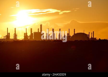 ConocoPhillips' Teesside Oil Terminal and industrial skyline at Seal Sands, Teesside, UK during a stunning sunset. Photographed from South Gare. Stock Photo