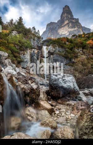 small waterfall in corpassa valley dominated by the trieste tower,civetta group,dolomites,taibon agordino,province of belluno,veneto,italy Stock Photo